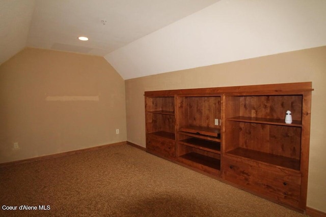 additional living space with carpet floors and lofted ceiling