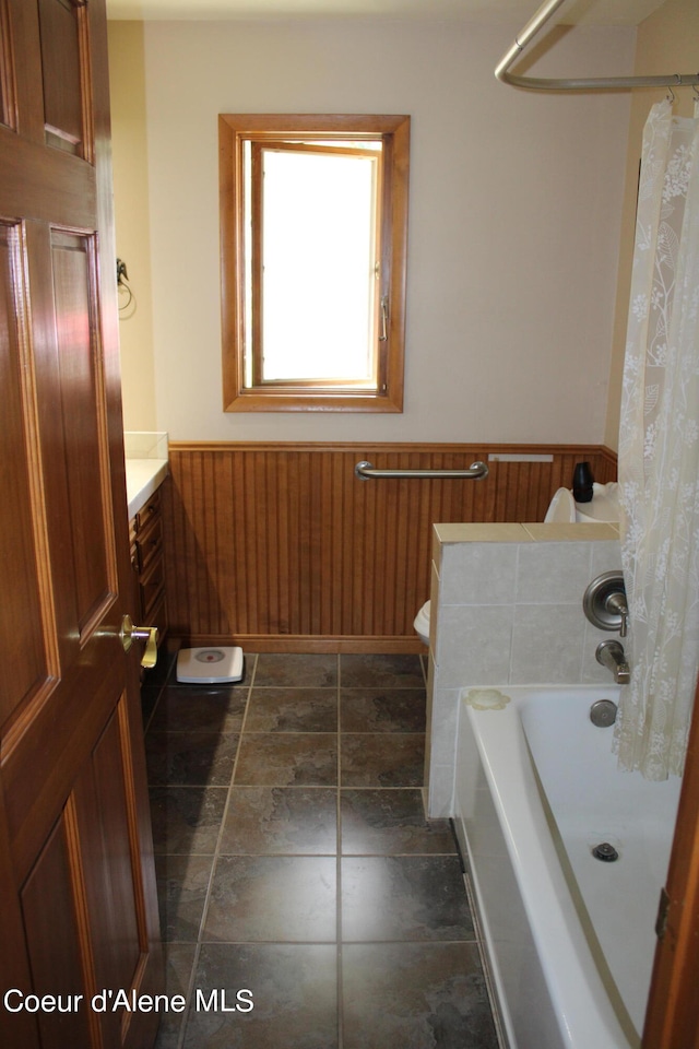 bathroom featuring vanity, toilet, and tile flooring