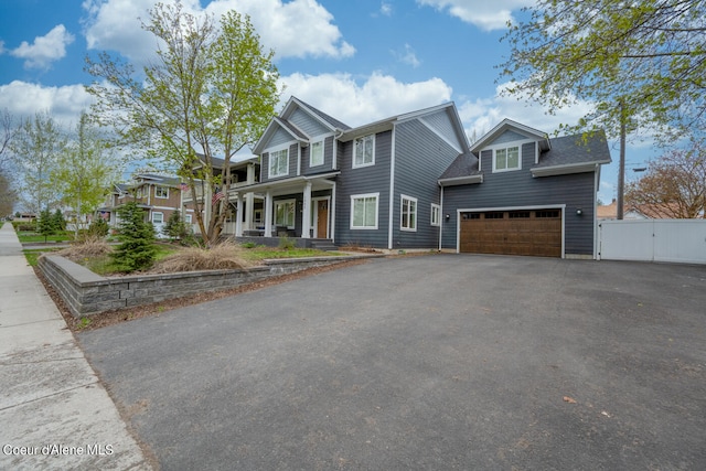 view of front of home with a garage and covered porch