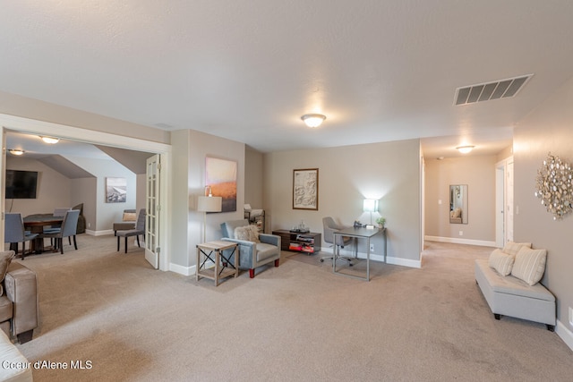 sitting room with carpet floors