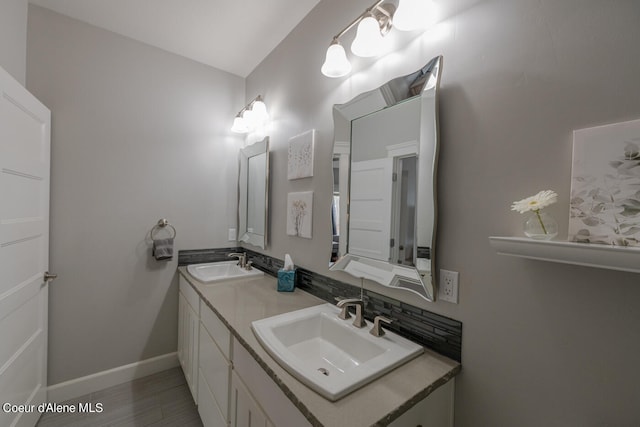 bathroom featuring tile flooring and dual bowl vanity