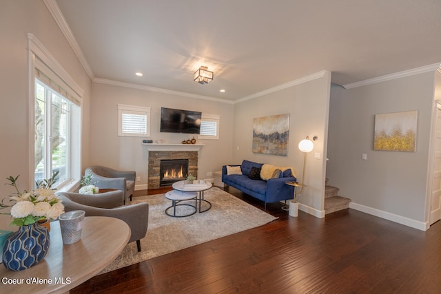 living room with crown molding, dark wood-type flooring, and a fireplace