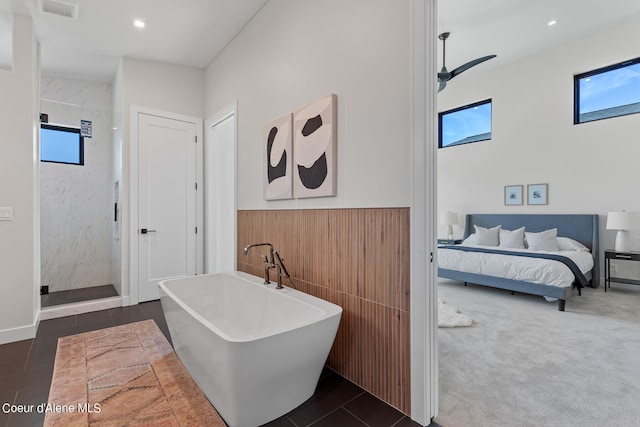 bathroom with tile patterned flooring and plus walk in shower