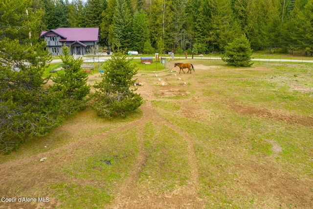 birds eye view of property with a rural view