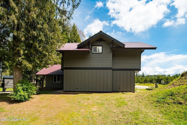 view of property exterior with a yard