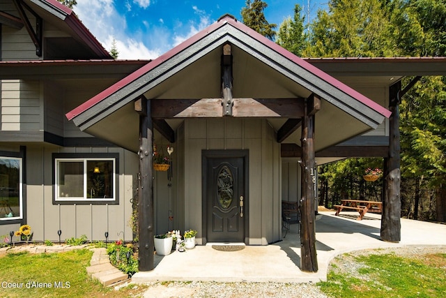 entrance to property with a patio area