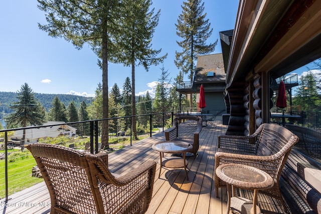 wooden deck with an outdoor living space