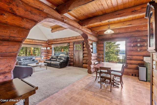 living room featuring a wealth of natural light, wood ceiling, and log walls