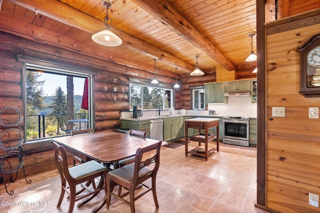 dining area with sink, wooden ceiling, rustic walls, and a wealth of natural light