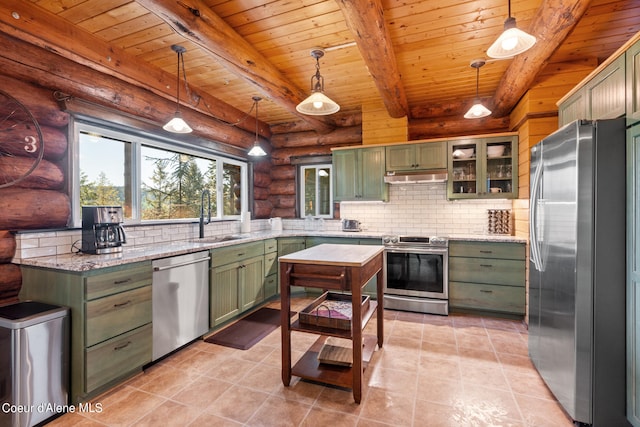 kitchen with appliances with stainless steel finishes, green cabinetry, and hanging light fixtures