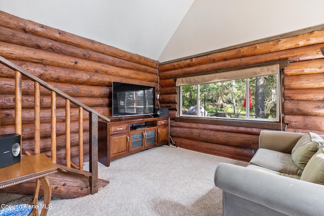 carpeted living room featuring high vaulted ceiling and rustic walls