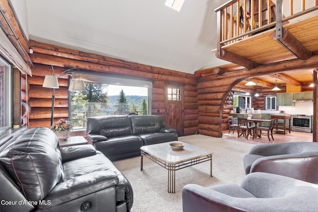 living room with log walls, high vaulted ceiling, and beamed ceiling