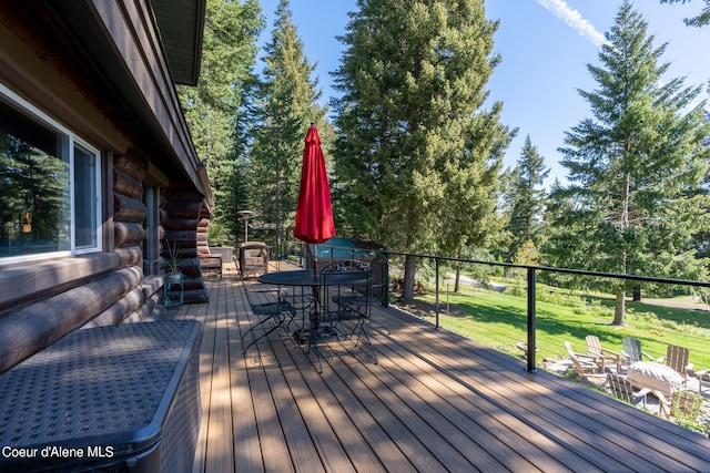 wooden terrace with a yard