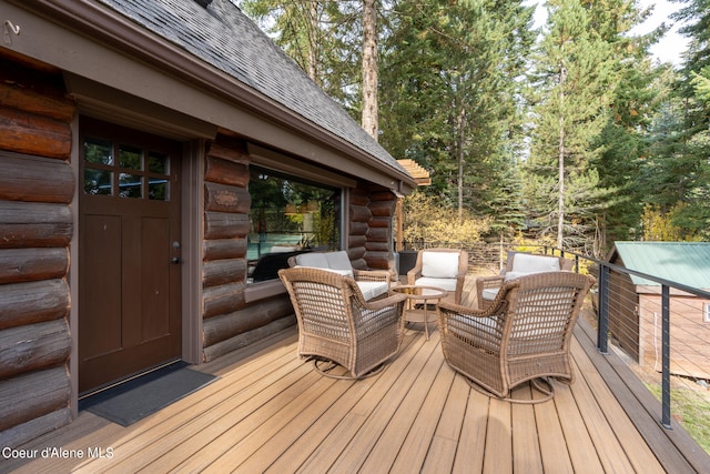 deck featuring outdoor lounge area