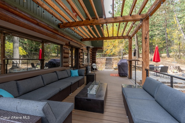 wooden deck featuring grilling area, outdoor lounge area, and a pergola