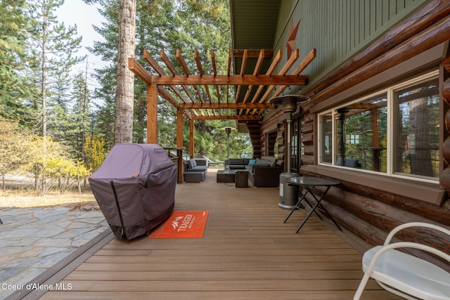 deck featuring an outdoor hangout area, a grill, and a pergola