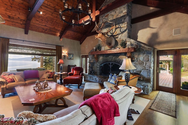 living room with hardwood / wood-style flooring, wooden ceiling, a stone fireplace, high vaulted ceiling, and beamed ceiling