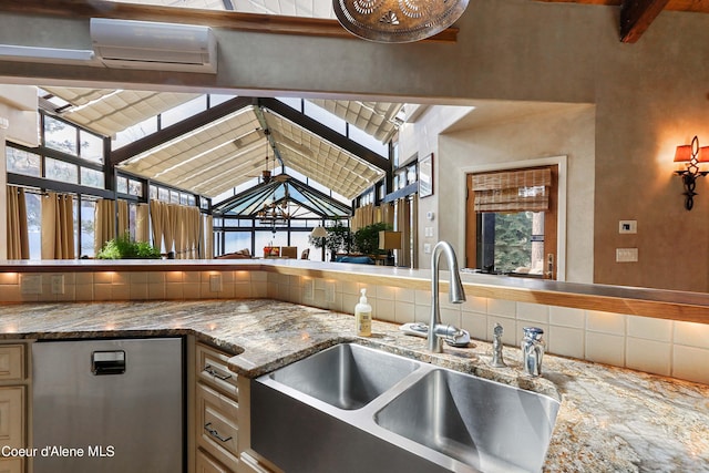 kitchen featuring high vaulted ceiling, sink, beamed ceiling, and stone countertops