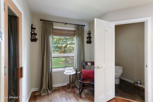 interior space with tile flooring and toilet