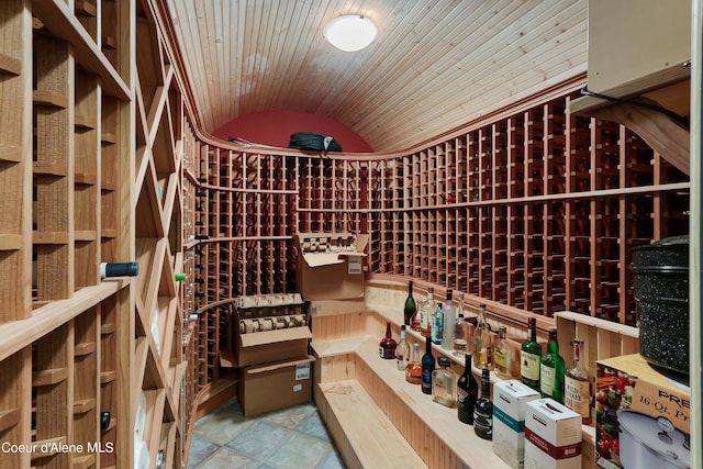 wine room featuring tile flooring, vaulted ceiling, and wood ceiling