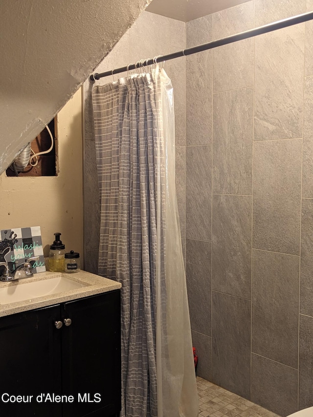 bathroom with vanity and curtained shower