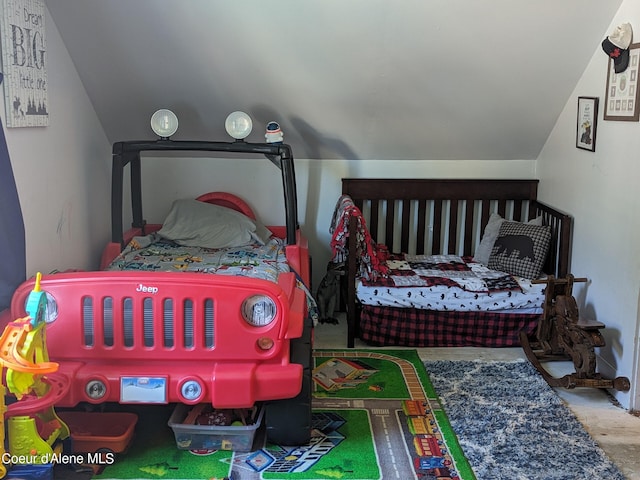 bedroom featuring hardwood / wood-style flooring and lofted ceiling