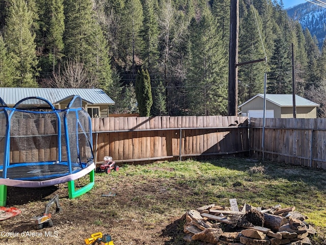 view of yard with a trampoline