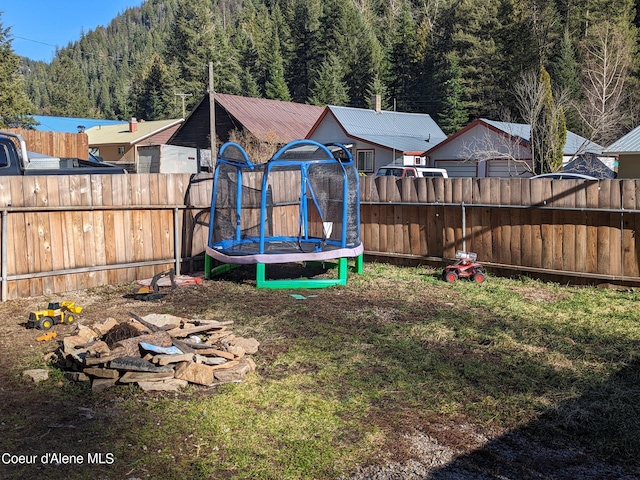 view of yard with a trampoline