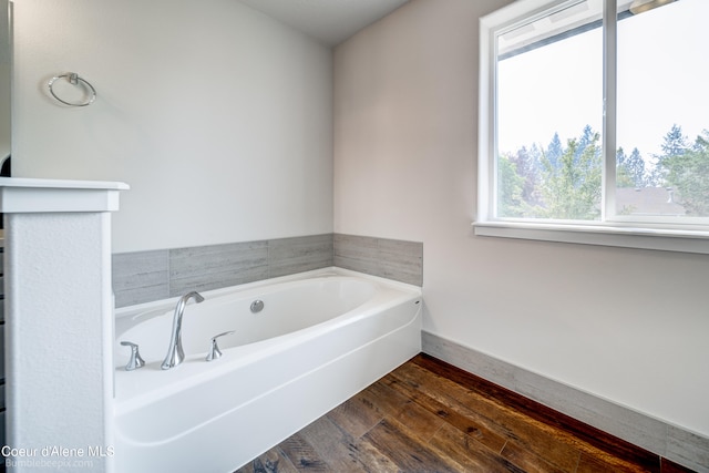 bathroom featuring a bathtub and hardwood / wood-style floors