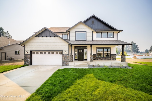 craftsman-style house featuring a front lawn and a garage