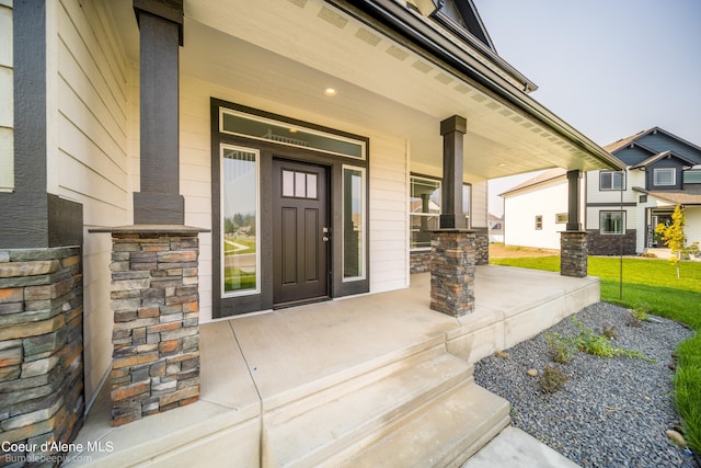 doorway to property featuring a porch