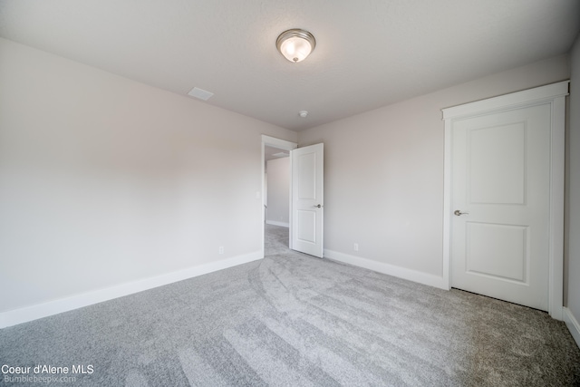 unfurnished bedroom with carpet