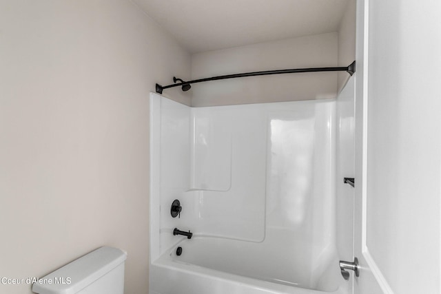 bathroom with shower / tub combination and toilet