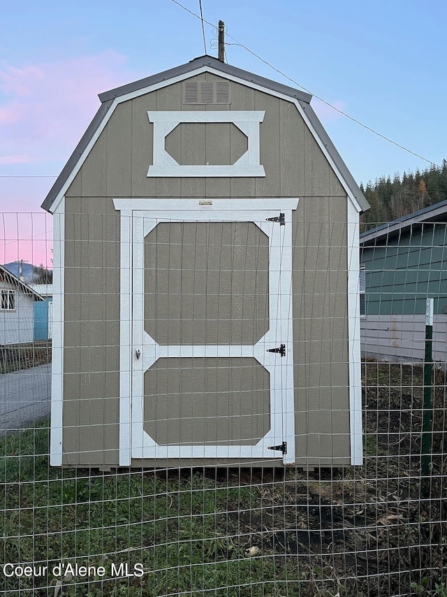 view of outdoor structure at dusk