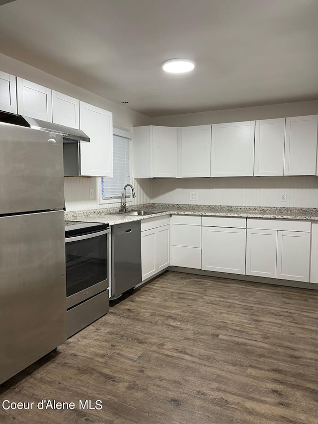 kitchen featuring sink, white cabinets, dark hardwood / wood-style floors, and stainless steel appliances