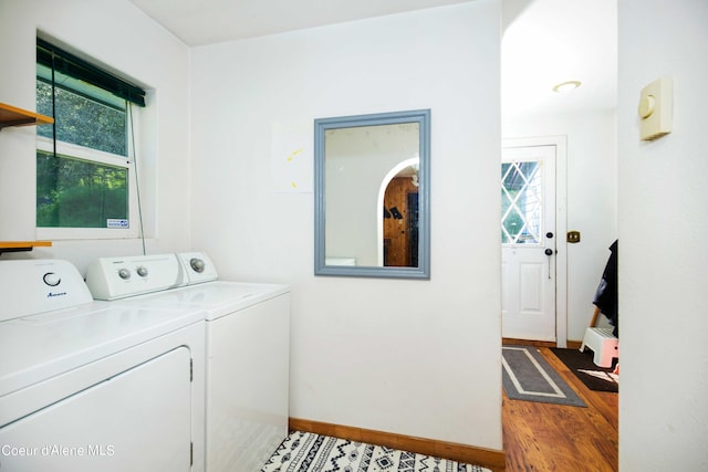 washroom with washer and dryer and hardwood / wood-style floors