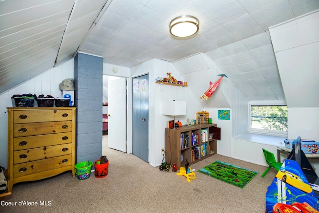 playroom featuring carpet flooring and vaulted ceiling