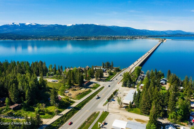 aerial view featuring a water and mountain view