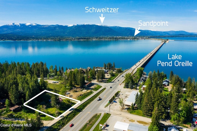 aerial view featuring a water and mountain view