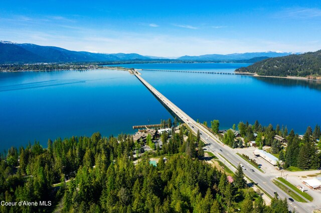 aerial view featuring a water and mountain view