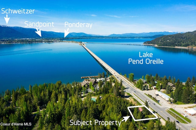 bird's eye view with a water and mountain view