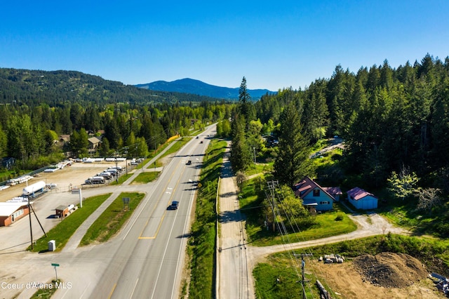 birds eye view of property featuring a mountain view