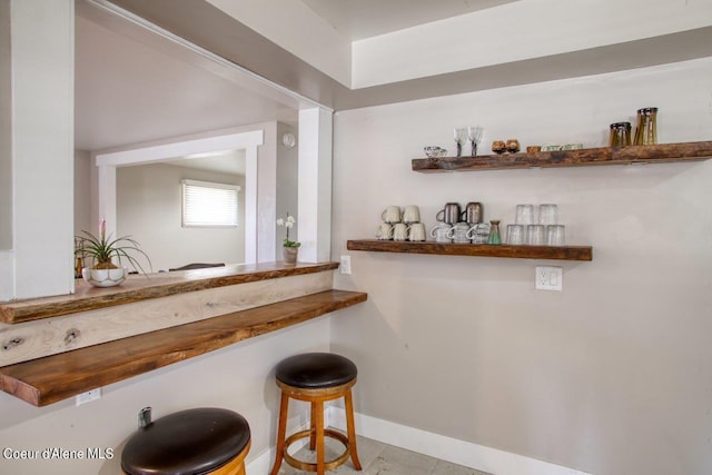 bar with light tile patterned floors