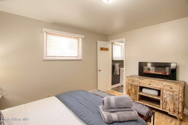 bedroom with light hardwood / wood-style floors