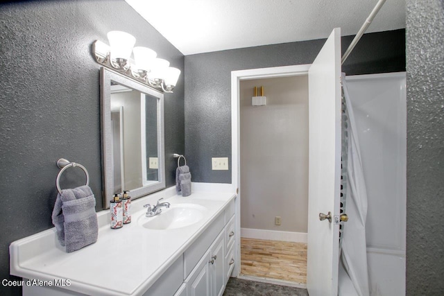 bathroom featuring vanity and wood-type flooring