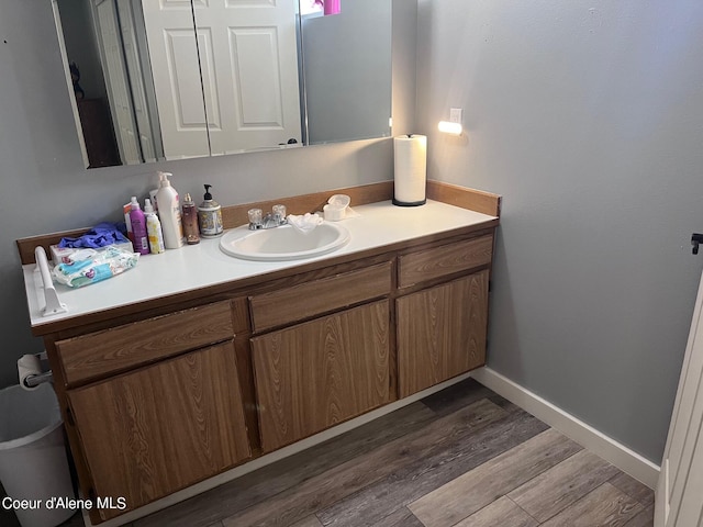 bathroom featuring vanity and hardwood / wood-style floors