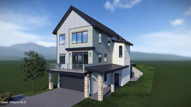 view of front of home featuring a garage, a front lawn, and a balcony