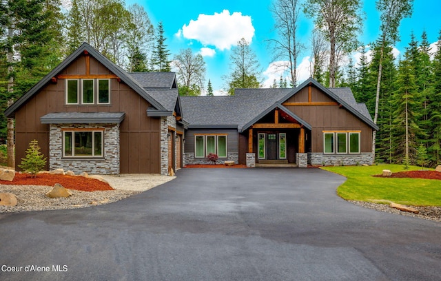 craftsman inspired home with a front yard