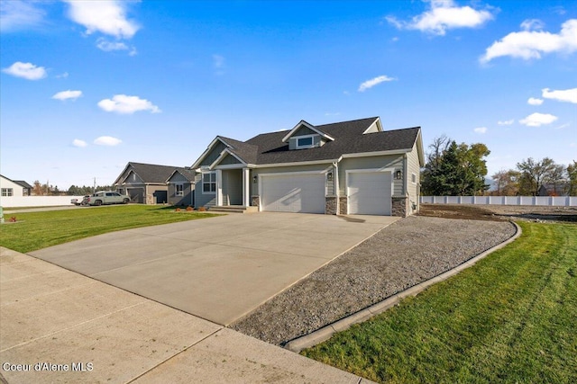 view of front of house featuring a garage and a front lawn