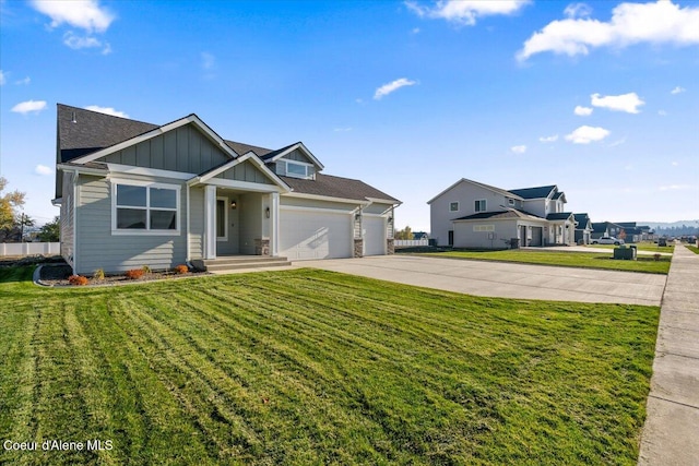 view of front of house with a garage and a front yard